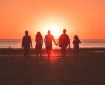 Family walking on beach